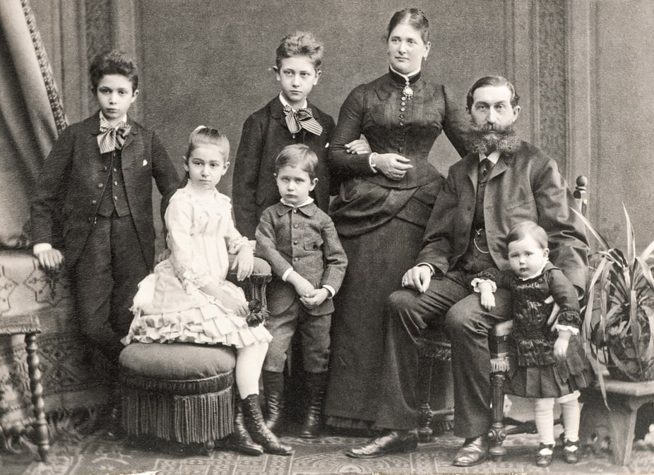 Old  photo. Parents with five children. Vintage picture